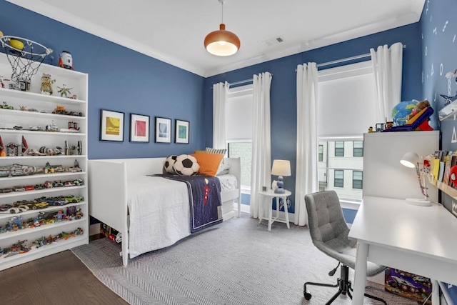 bedroom with hardwood / wood-style floors