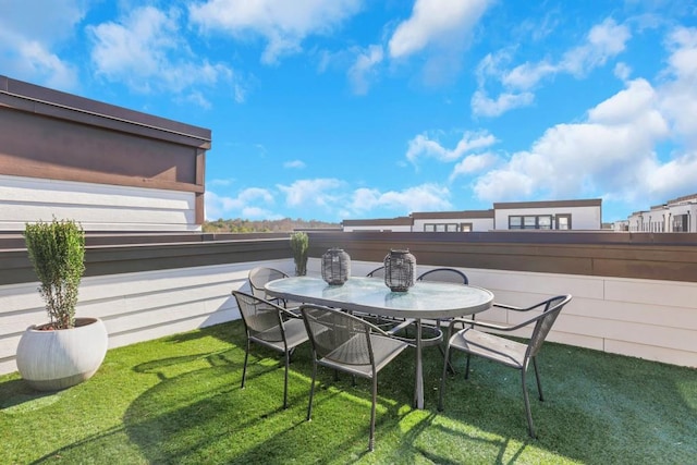 view of patio featuring a balcony