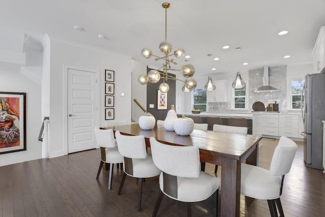 dining space with crown molding and dark hardwood / wood-style floors