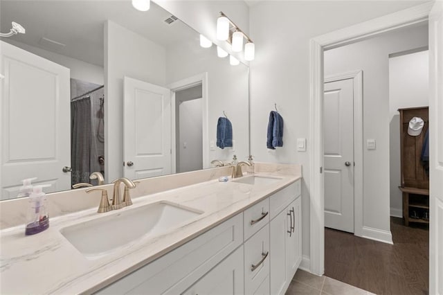 bathroom with vanity and curtained shower