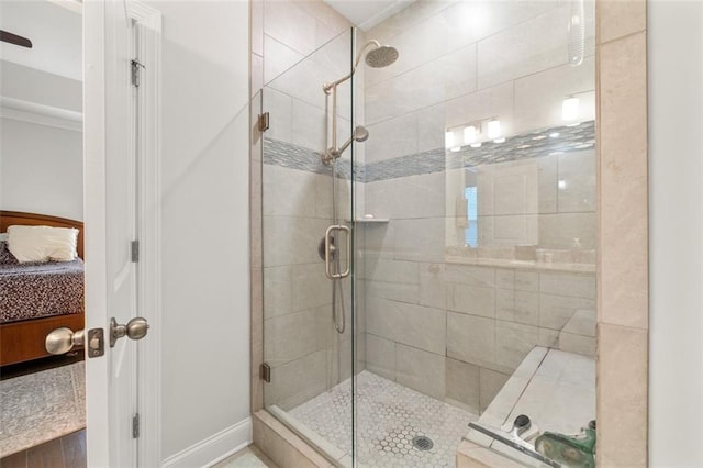 bathroom with a shower with door