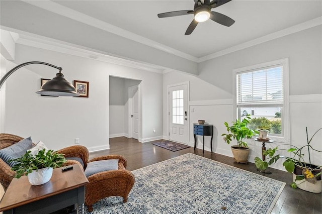 interior space with dark hardwood / wood-style flooring, crown molding, and ceiling fan