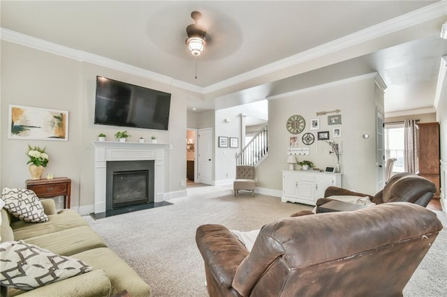 3060 Mccannon Mill Dr, Dacula, GA 30019 - living area with light colored carpet, stairs, crown molding, a fireplace with flush hearth, and baseboards