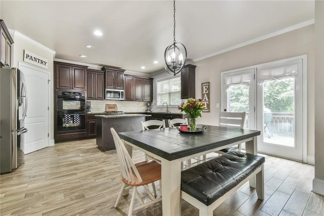 3060 Mccannon Mill Dr, Dacula, GA 30019 - dining area featuring ornamental molding, a chandelier, recessed lighting, and light wood finished floors