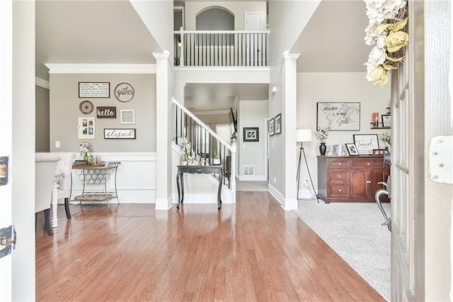 3060 Mccannon Mill Dr, Dacula, GA 30019 - entryway featuring stairs, crown molding, wood finished floors, baseboards, and ornate columns