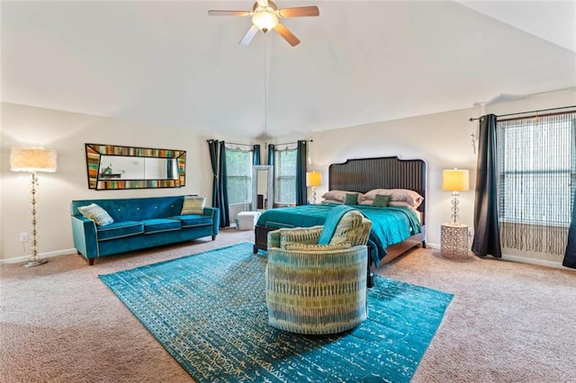 carpeted bedroom with ceiling fan and lofted ceiling