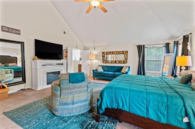 bedroom with ceiling fan, high vaulted ceiling, and carpet flooring