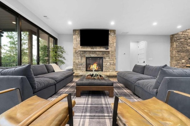 living room with a stone fireplace