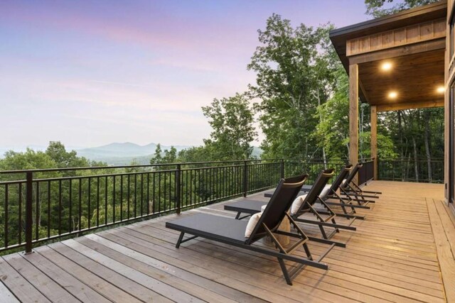 deck at dusk with a mountain view