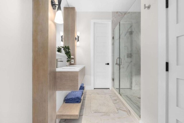 bathroom with vanity and a shower with shower door