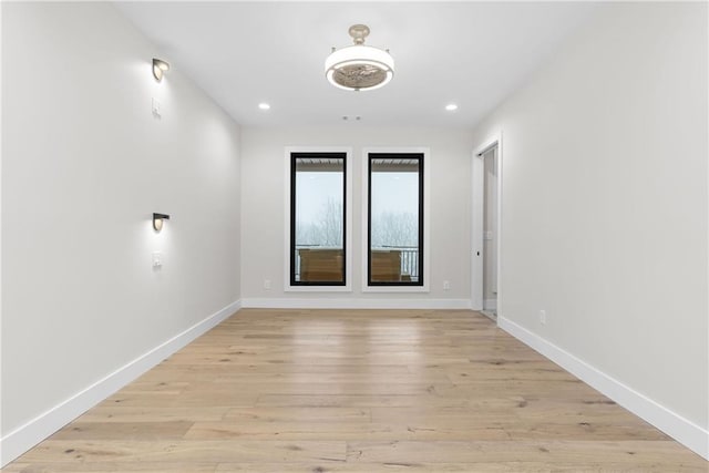 unfurnished room featuring light hardwood / wood-style floors