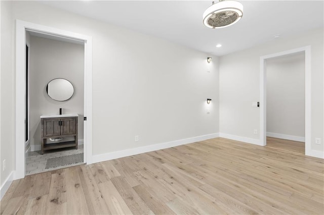 spare room with light hardwood / wood-style floors