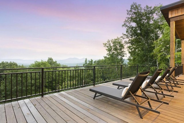 deck at dusk with a mountain view