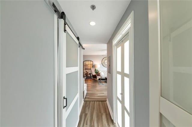 3338 Peachtree Rd NE Unit 1507, Atlanta, GA 30326 - hall with a barn door and wood finished floors