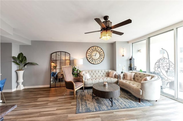 3338 Peachtree Rd NE Unit 1507, Atlanta, GA 30326 - living room featuring healthy amount of natural light, wood finished floors, and a wall of windows