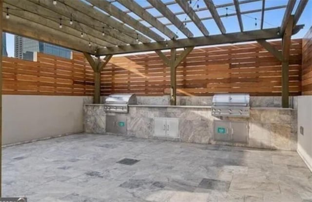 3338 Peachtree Rd NE Unit 1507, Atlanta, GA 30326 - view of patio featuring area for grilling and a pergola