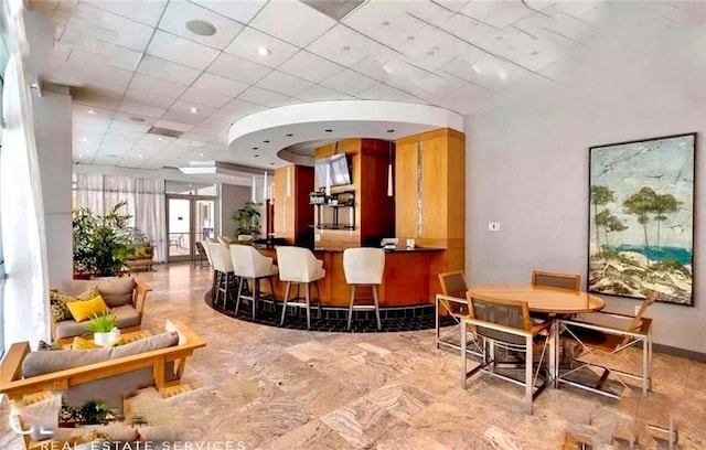 3338 Peachtree Rd NE Unit 1507, Atlanta, GA 30326 - bar area featuring a paneled ceiling and baseboards