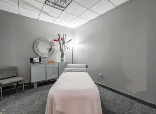 3338 Peachtree Rd NE Unit 1507, Atlanta, GA 30326 - bedroom featuring dark colored carpet and a paneled ceiling