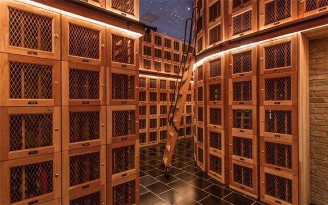 3338 Peachtree Rd NE Unit 1507, Atlanta, GA 30326 - wine cellar with dark tile patterned floors and brick wall