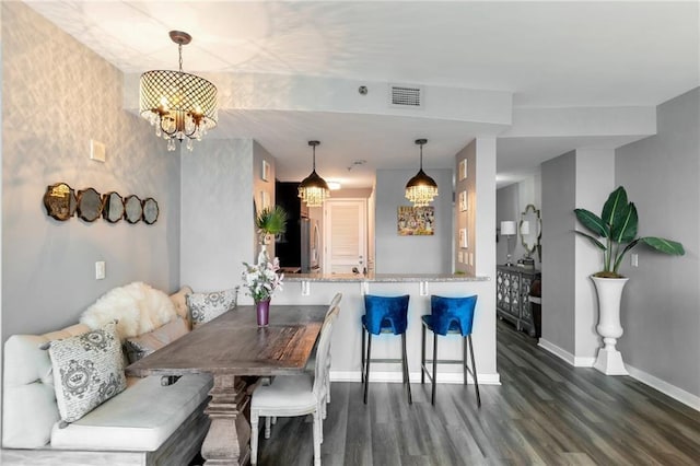 3338 Peachtree Rd NE Unit 1507, Atlanta, GA 30326 - dining space featuring a chandelier and wood finished floors