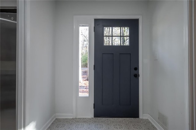 entrance foyer featuring a wealth of natural light