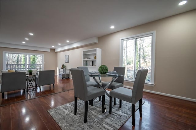 dining area featuring dark hardwood / wood-style floors