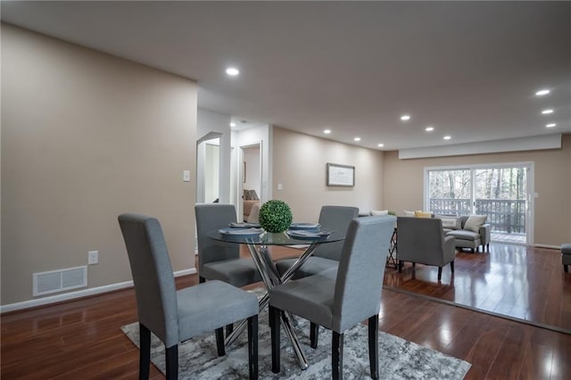 dining space featuring dark hardwood / wood-style flooring