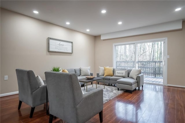 living room with dark hardwood / wood-style flooring