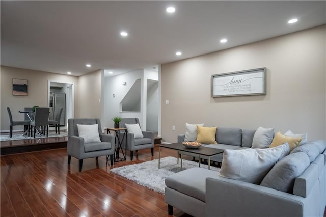 living room with dark hardwood / wood-style flooring