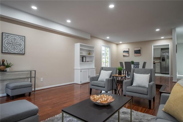 living room with dark hardwood / wood-style floors