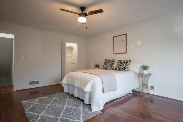 bedroom featuring dark hardwood / wood-style floors and ceiling fan