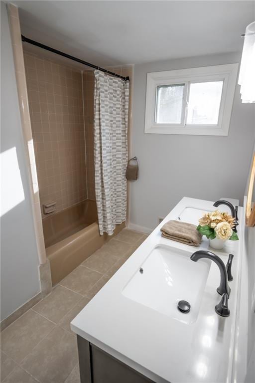 bathroom with shower / bath combination with curtain, vanity, and tile patterned flooring