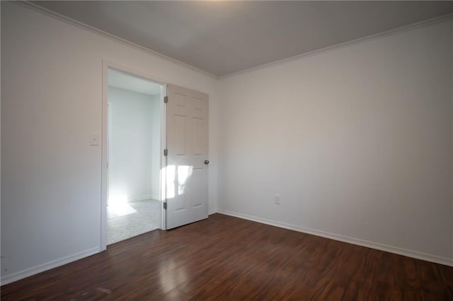 unfurnished room featuring crown molding and dark hardwood / wood-style floors