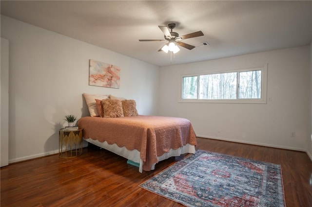 bedroom featuring dark wood-type flooring and ceiling fan