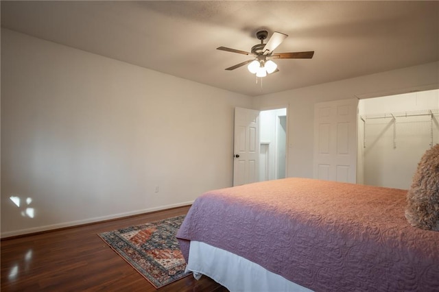 bedroom with dark wood-type flooring and ceiling fan