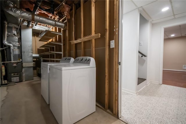 laundry room featuring separate washer and dryer and heating unit