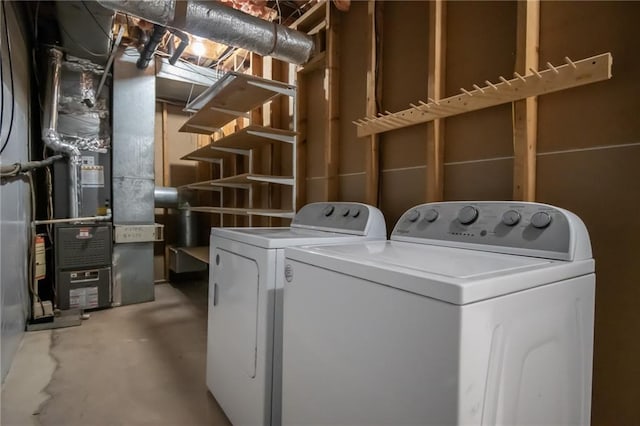 laundry area with heating unit and independent washer and dryer