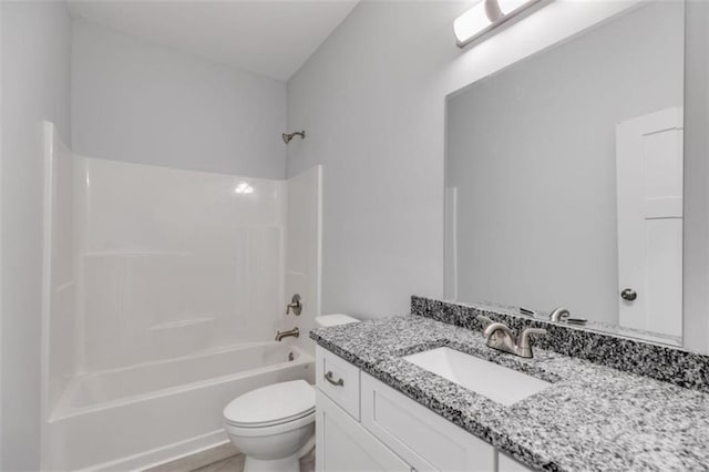 bathroom featuring shower / bath combination, vanity, and toilet