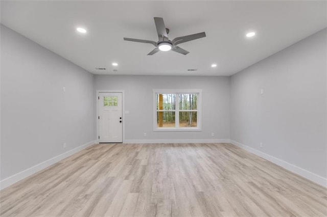 unfurnished living room with light wood-style flooring, baseboards, a ceiling fan, and recessed lighting