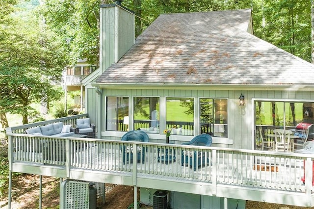 back of house with an outdoor hangout area, a wooden deck, and central air condition unit