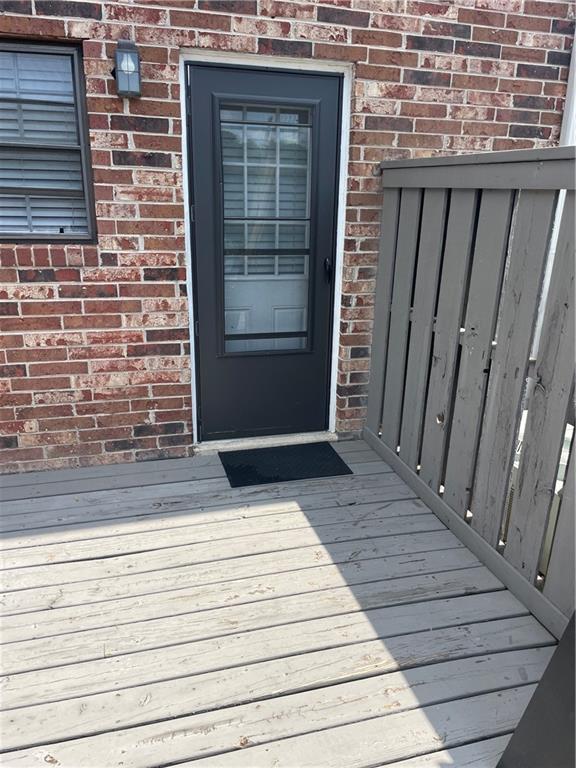 entrance to property with a deck