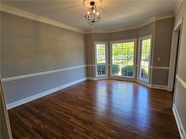 unfurnished room with a notable chandelier, ornamental molding, baseboards, and dark wood-style flooring