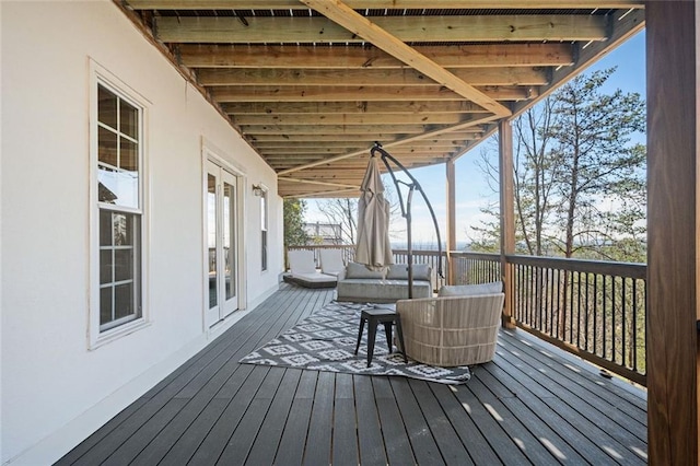 deck with an outdoor living space and french doors