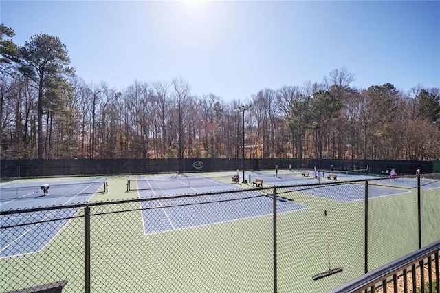 view of sport court featuring fence