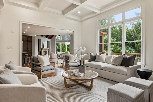 16720 Quayside Dr, Alpharetta, GA 30004 - living room with beamed ceiling, coffered ceiling, a glass covered fireplace, wood finished floors, and recessed lighting