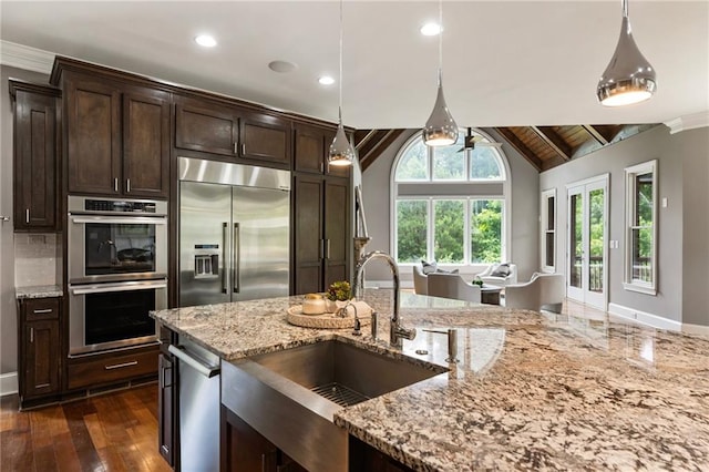 16720 Quayside Dr, Alpharetta, GA 30004 - kitchen with appliances with stainless steel finishes, a sink, dark brown cabinetry, baseboards, and recessed lighting
