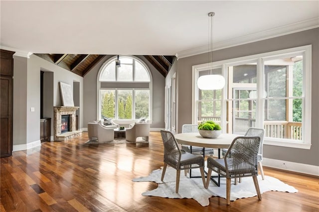 16720 Quayside Dr, Alpharetta, GA 30004 - dining room with light wood-style floors, baseboards, a stone fireplace, and ornamental molding