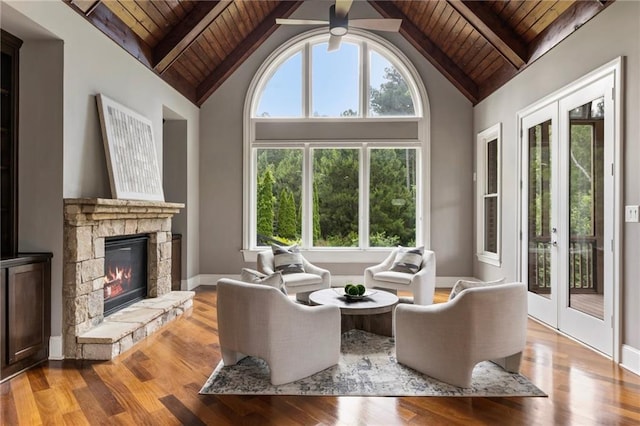 16720 Quayside Dr, Alpharetta, GA 30004 - living room with wooden ceiling with exposed beams, wood finished floors, a stone fireplace, high vaulted ceiling, and french doors