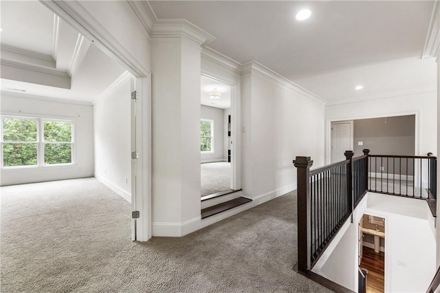 corridor with carpet, crown molding, an upstairs landing, baseboards, and recessed lighting