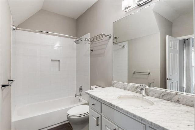 full bath featuring toilet, lofted ceiling,  shower combination, and vanity